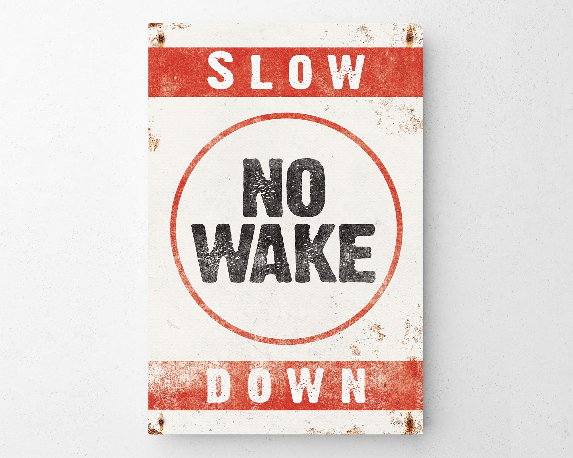 a red and white sign that says slow no wake down