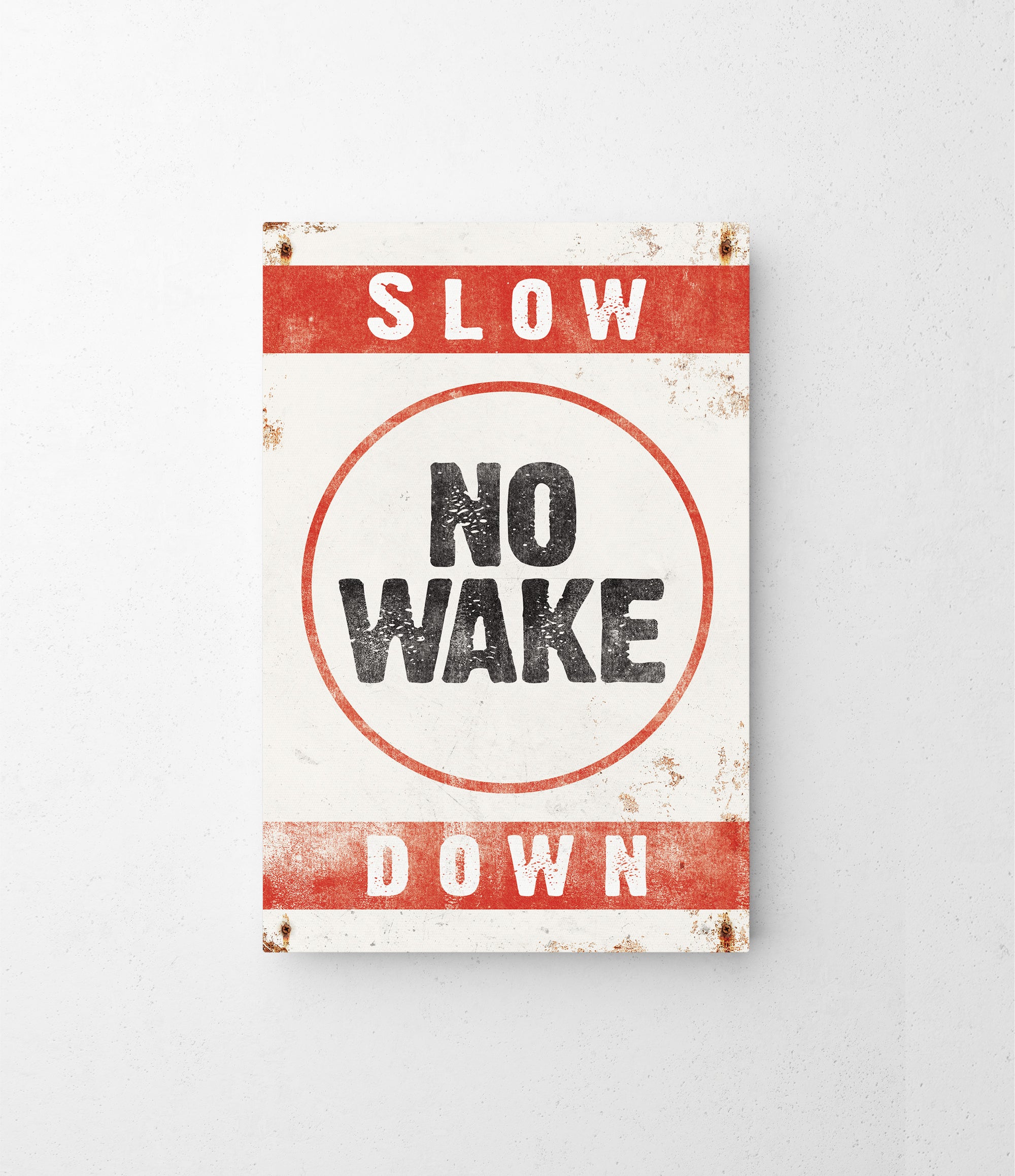 a red and white sign that says slow no wake down