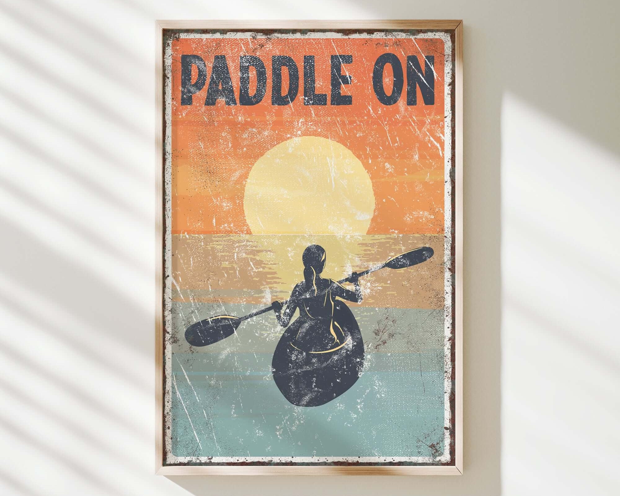 a vintage paddle on poster hangs on a wall