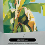 The image is an aluminum print depicting a close-up view of a banana plant with vibrant green leaves and yellow bananas.