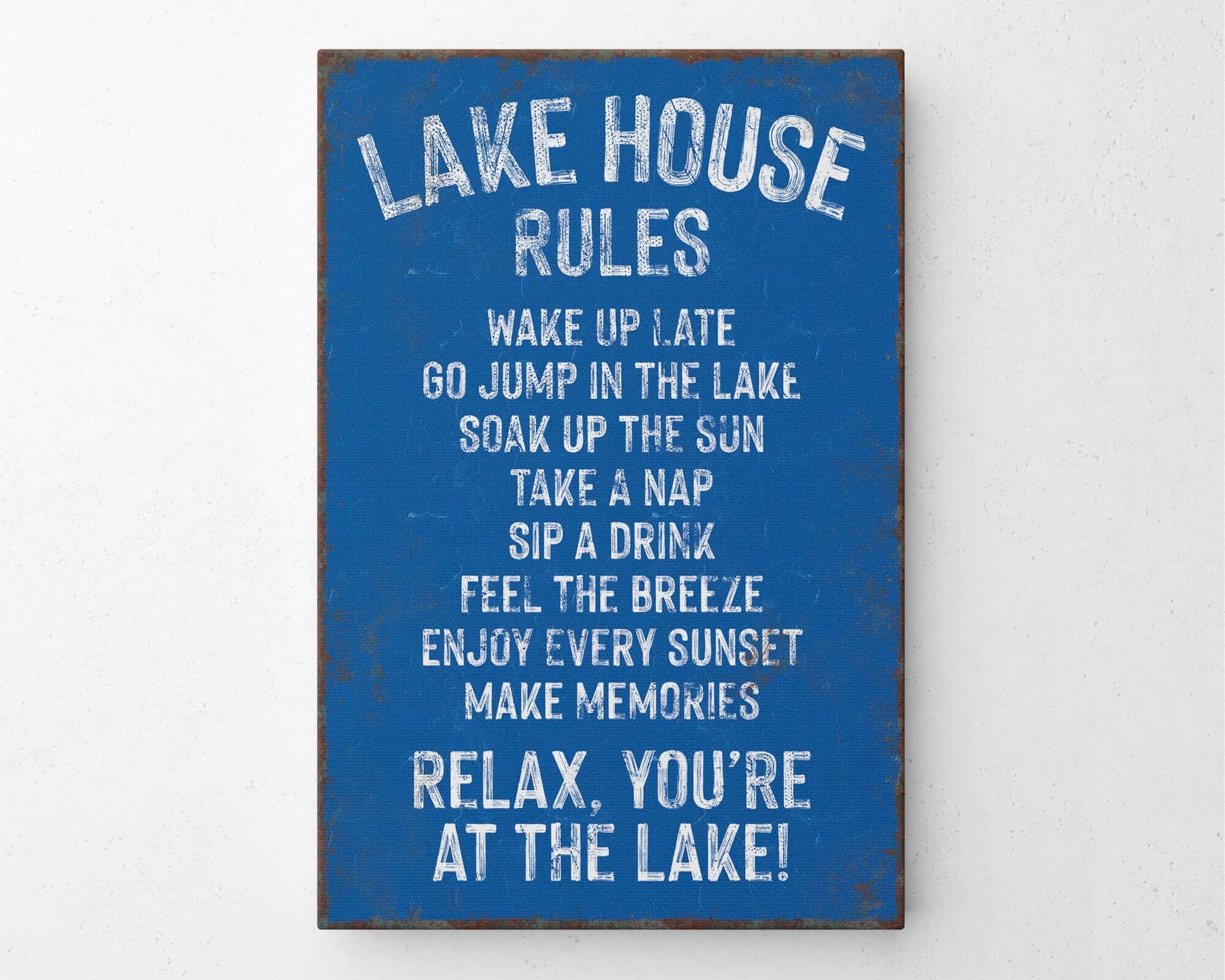 a blue sign that says lake house rules