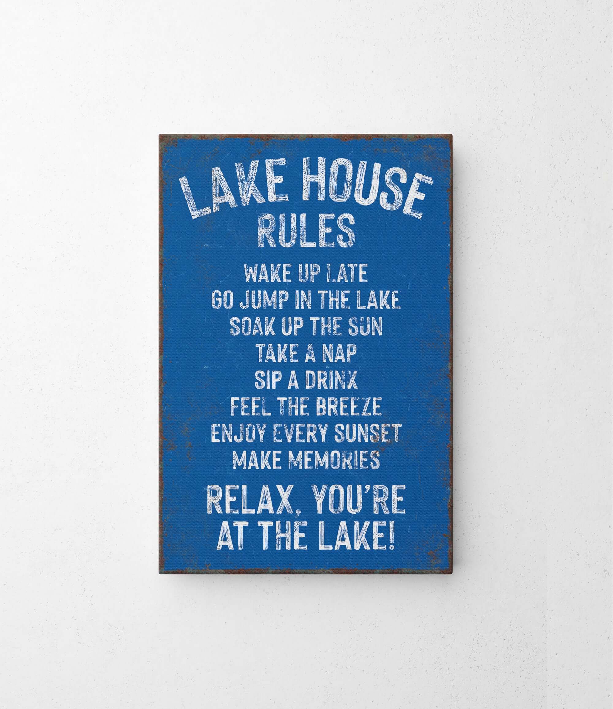 a blue sign that says lake house rules