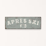 A rectangular sign with the text "APRÈS SKI" in white letters.