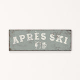 A rectangular sign with the text "APRÈS SKI" in white letters.