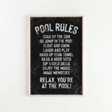 a black and white picture of a pool rules sign