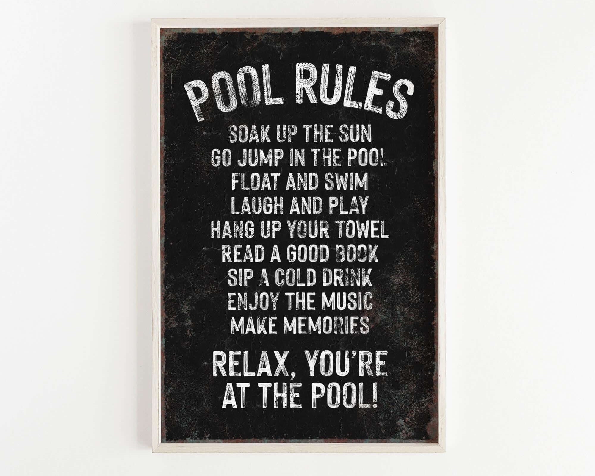 a black and white picture of a pool rules sign