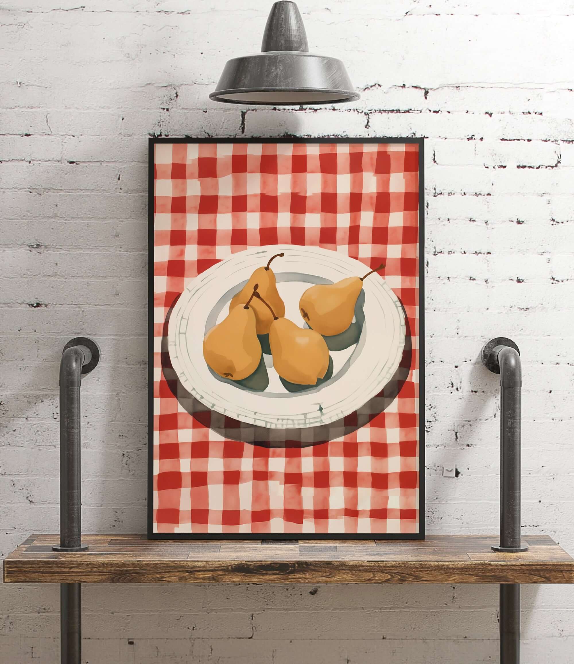 A framed illustration of a plate with three pears is displayed on a wooden shelf against a white brick wall.