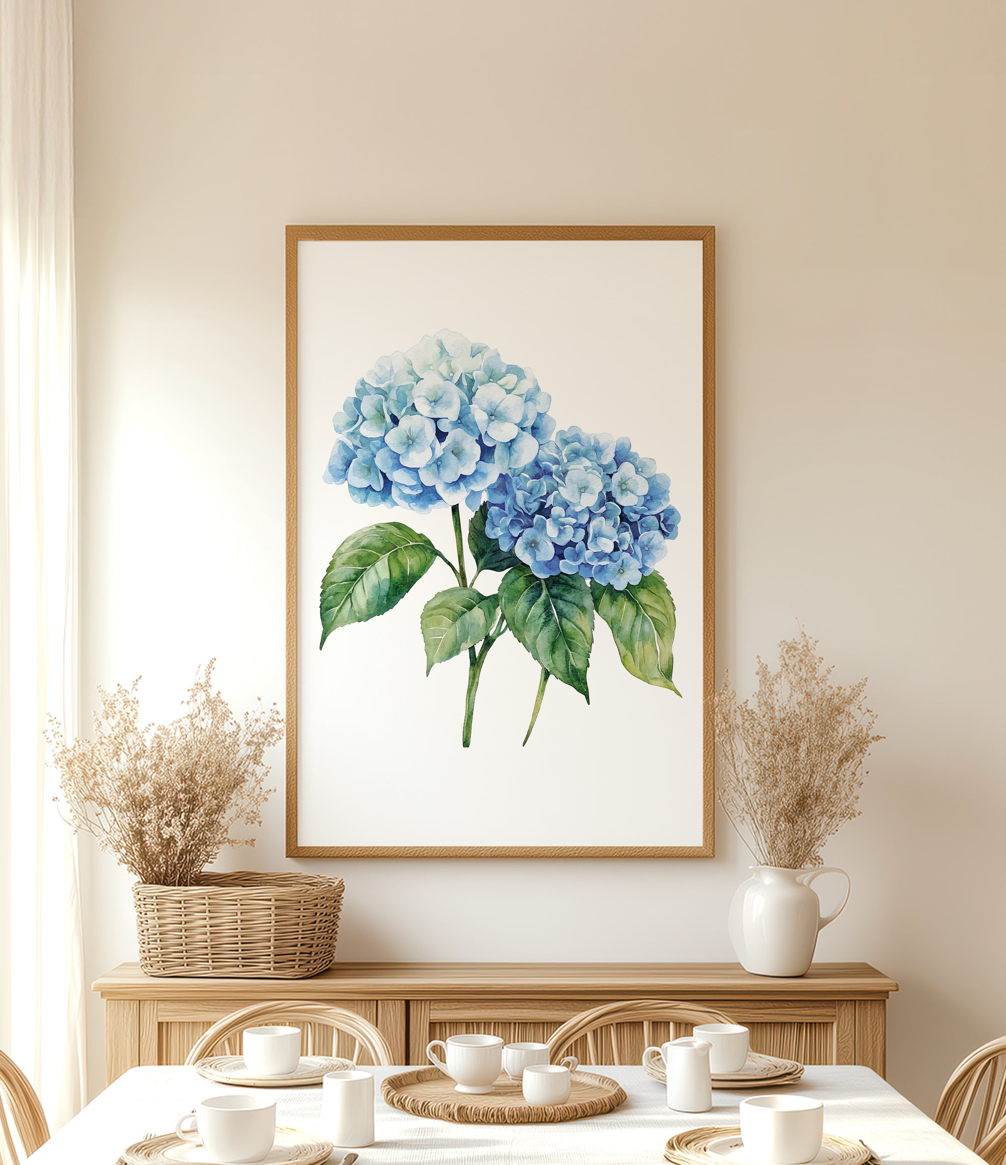 a dining room with a large framed painting of blue hydrangeas hanging on the wall above a wooden table. The table is set with white plates and cups, and there are two potted plants on either side of the table.