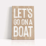 a wooden sign that says let&#39;s go on a boat