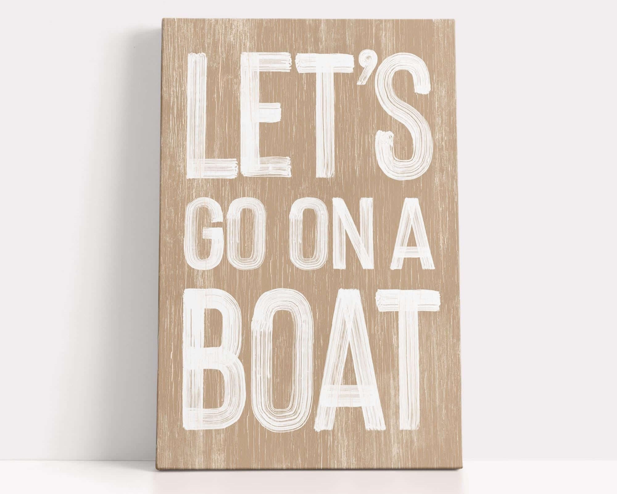 a wooden sign that says let's go on a boat