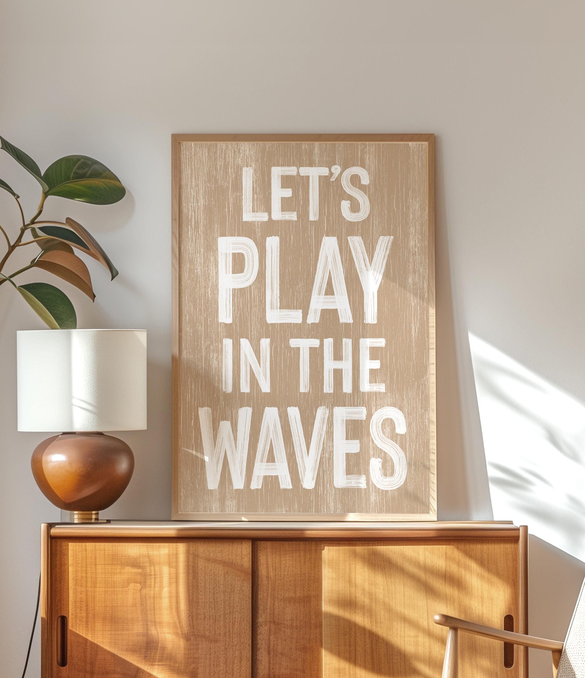 a wooden sign that says let&#39;s play in the waves