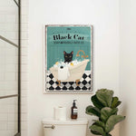 a bathroom with a toilet and a poster on the wall