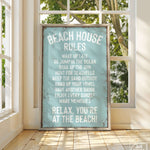 a sign on a window sill that says beach house rules