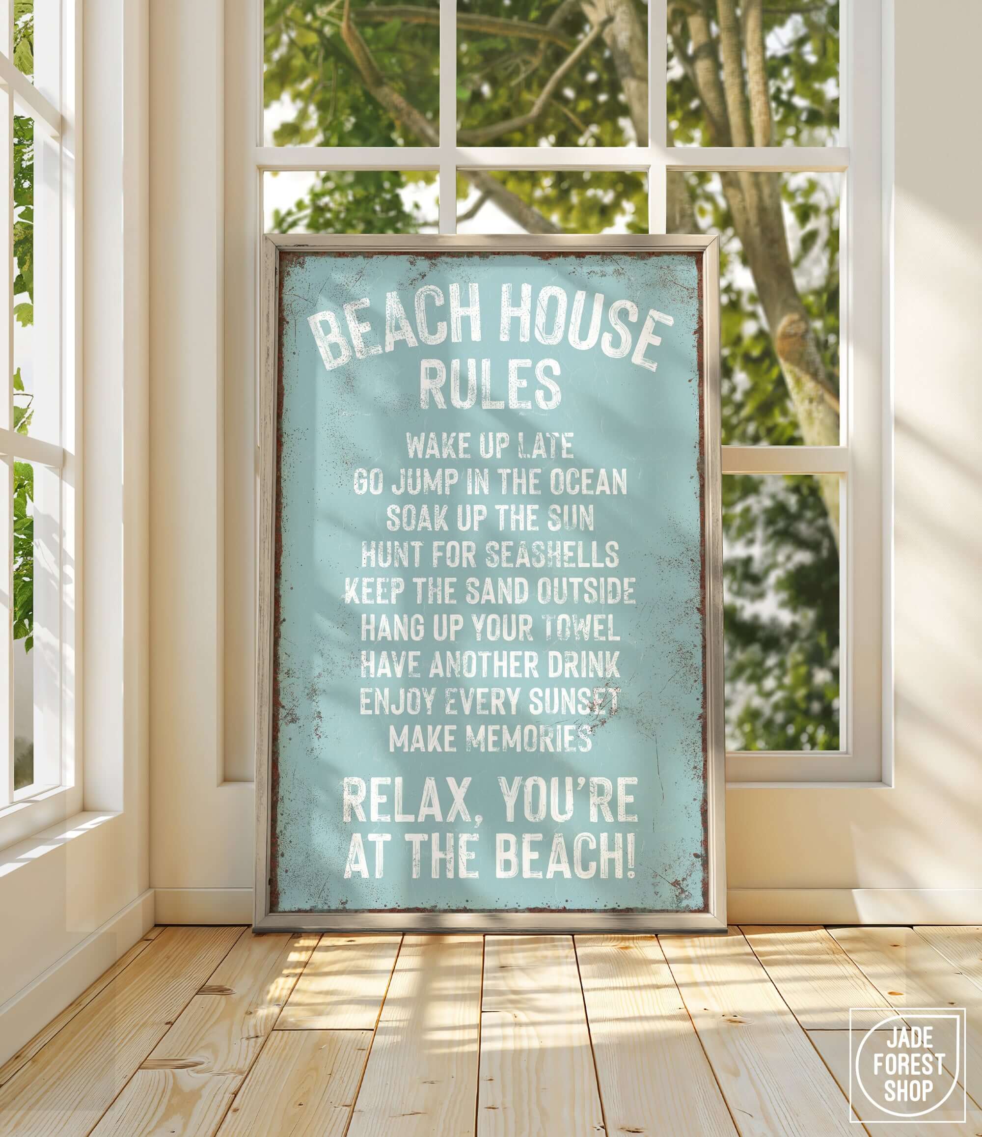 a sign on a window sill that says beach house rules