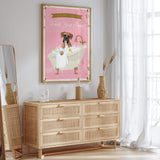 a pink poster of a dog in a bathtub, hanging on a wall above a wooden dresser with drawers.