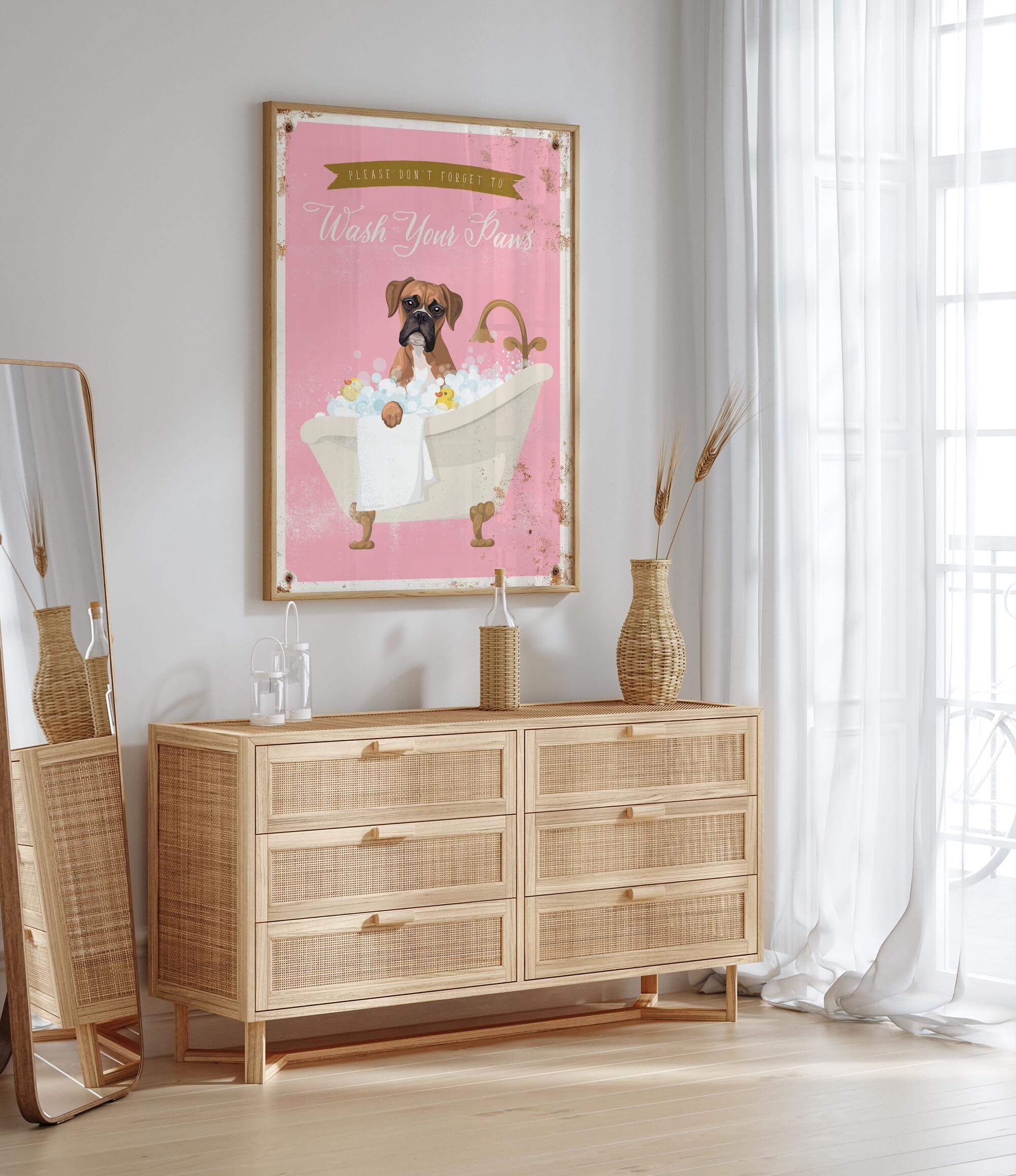 a pink poster of a dog in a bathtub, hanging on a wall above a wooden dresser with drawers.