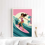 A framed illustration of a woman surfing on a pink surfboard against a tropical background.