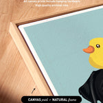 a vibrant artwork of a yellow duck with a black beak, set against a light blue background. The artwork is framed in a natural frame, and the text indicates that the artwork wraps around the sides of the canvas, and all canvas prints include hanging hardware for high quality archival inks.