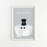 A framed illustration of a black dog sitting in a white bathtub filled with bubbles, with the text "WASH YOUR PAWS" displayed above it.