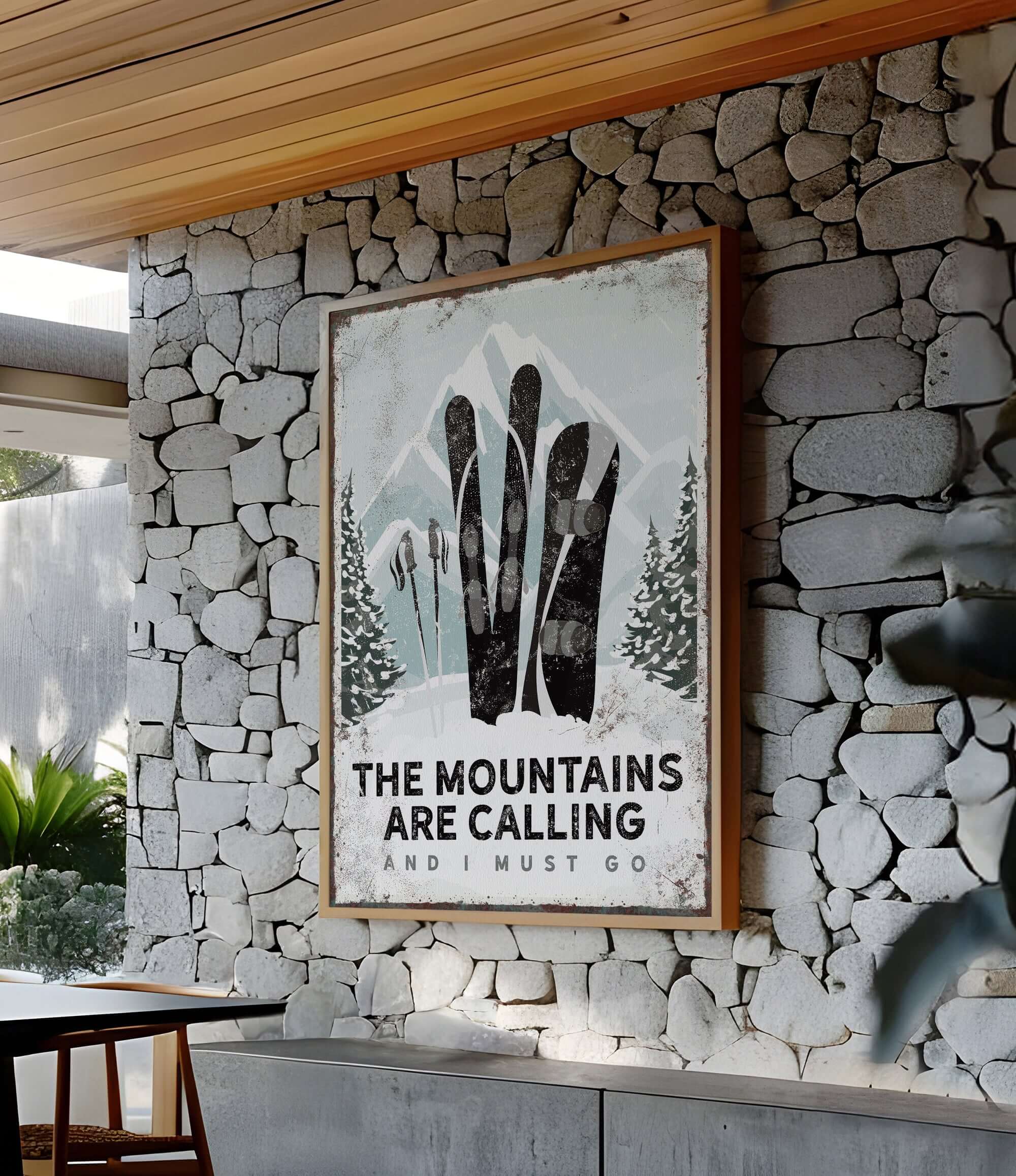 a stone wall with a sign that says the mountains are calling