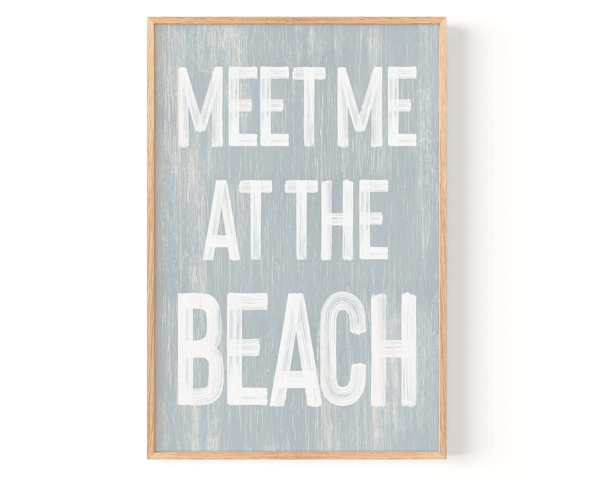 a wooden sign that says meet me at the beach