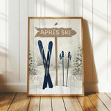A framed print featuring a winter scene with a sign that says "APRÈS SKI" and a pair of skis