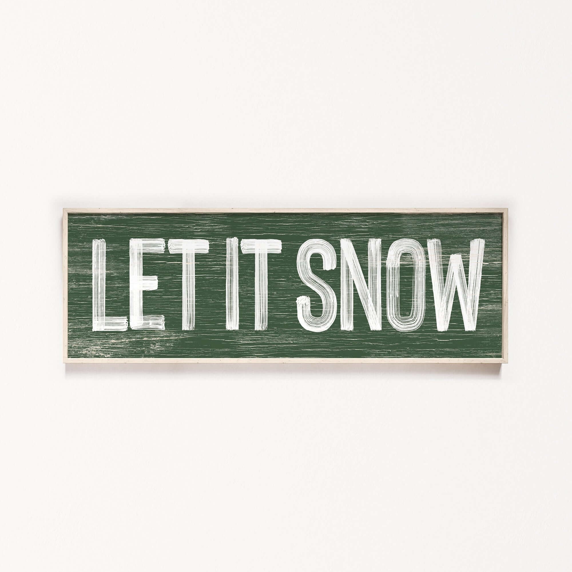 a wooden sign that says let it snow