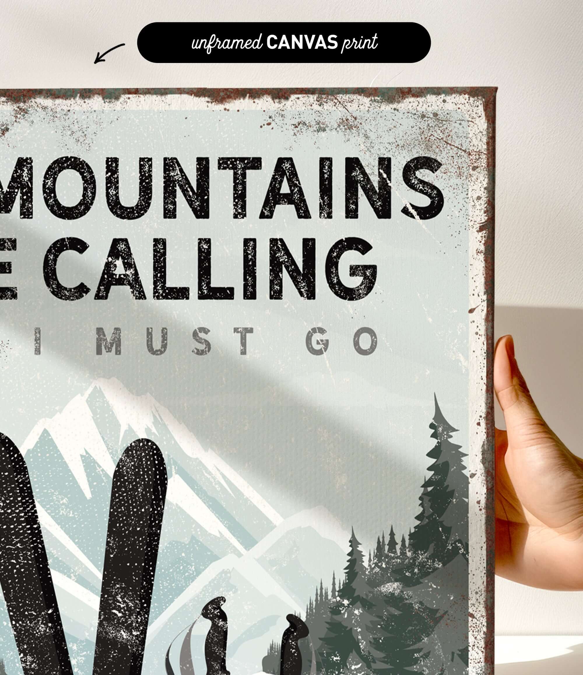 a hand holding a sign that says mountains are calling