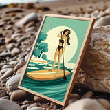 A framed illustration of a woman paddleboarding on a beach, with a serene ocean and sky background.
