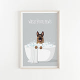 A framed illustration of a German Shepherd dog sitting in a white bathtub filled with bubbles, with the text "WASH YOUR PAWS" displayed above it.