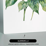 The image is an aluminum print featuring a watercolor painting of a flower with green leaves.