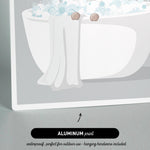a cat sitting in a bathtub filled with bubbles, with a towel draped over the side.