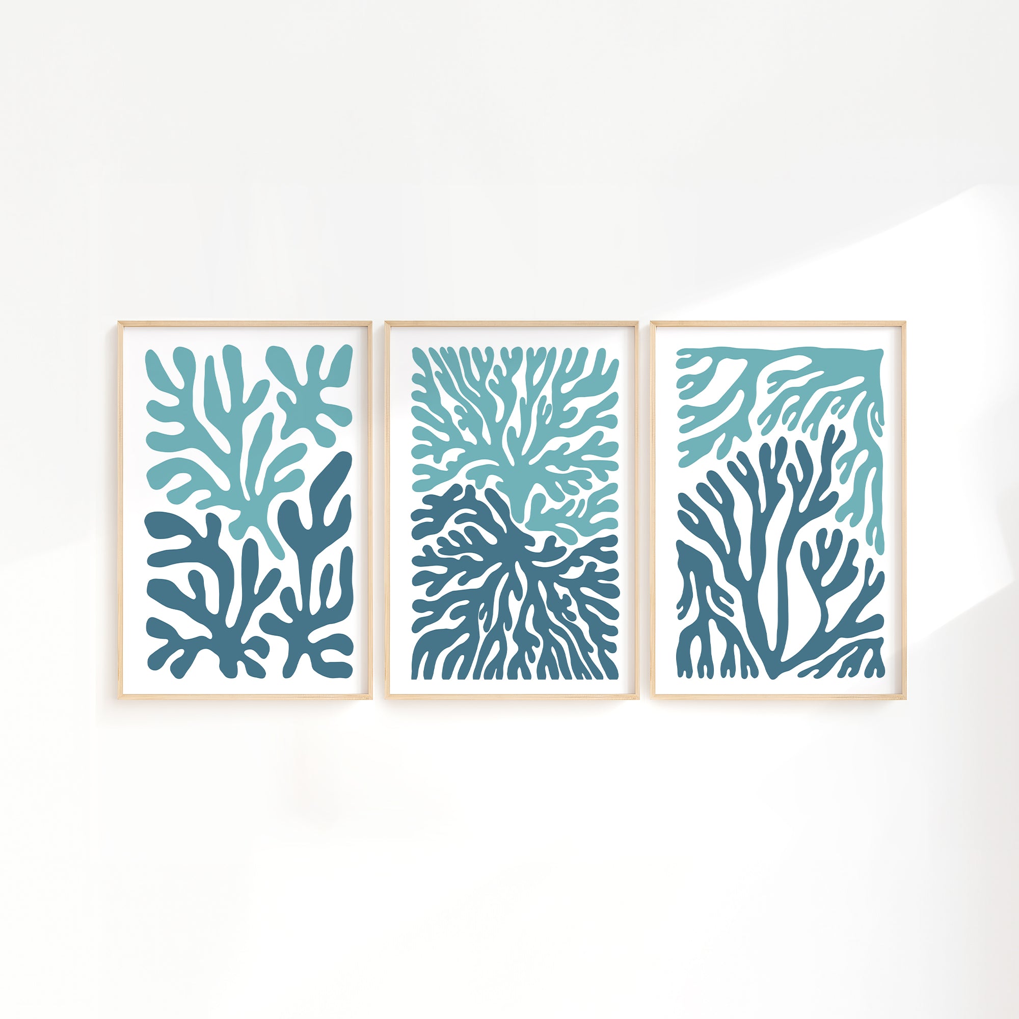 The Ocean Blocks Triptych | Set of Three Prints | 308 features framed abstract art with blue and teal coral-inspired shapes, bringing a modern accent to your home decor.