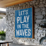 a blue sign that says let&#39;s play in the waves