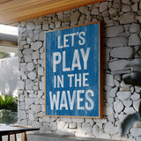 a blue sign that says let&#39;s play in the waves