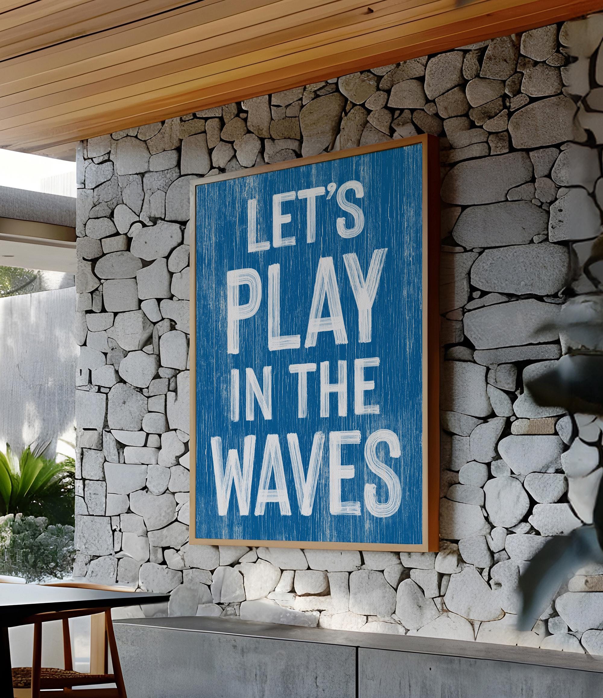a blue sign that says let&#39;s play in the waves
