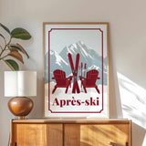 a framed poster of two red Adirondack chairs with skis, set against a mountain backdrop, with the text "Apres-ski" below the poster.