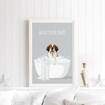 A framed poster with a cartoon image of a dog sitting in a bathtub filled with bubbles, accompanied by the text "WASH YOUR PAWS".