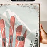 a person holding up a picture of a pair of skis