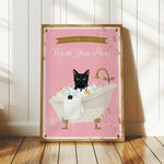 A framed poster with a black cat sitting in a bathtub filled with bubbles, accompanied by the text "Please don't forget to wash your paws".