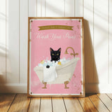 A framed poster with a black cat sitting in a bathtub filled with bubbles, accompanied by the text "Please don't forget to wash your paws".