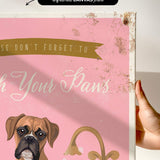 a pink background with a brown dog and a golden faucet, along with the text "Don't forget to wash your paws".