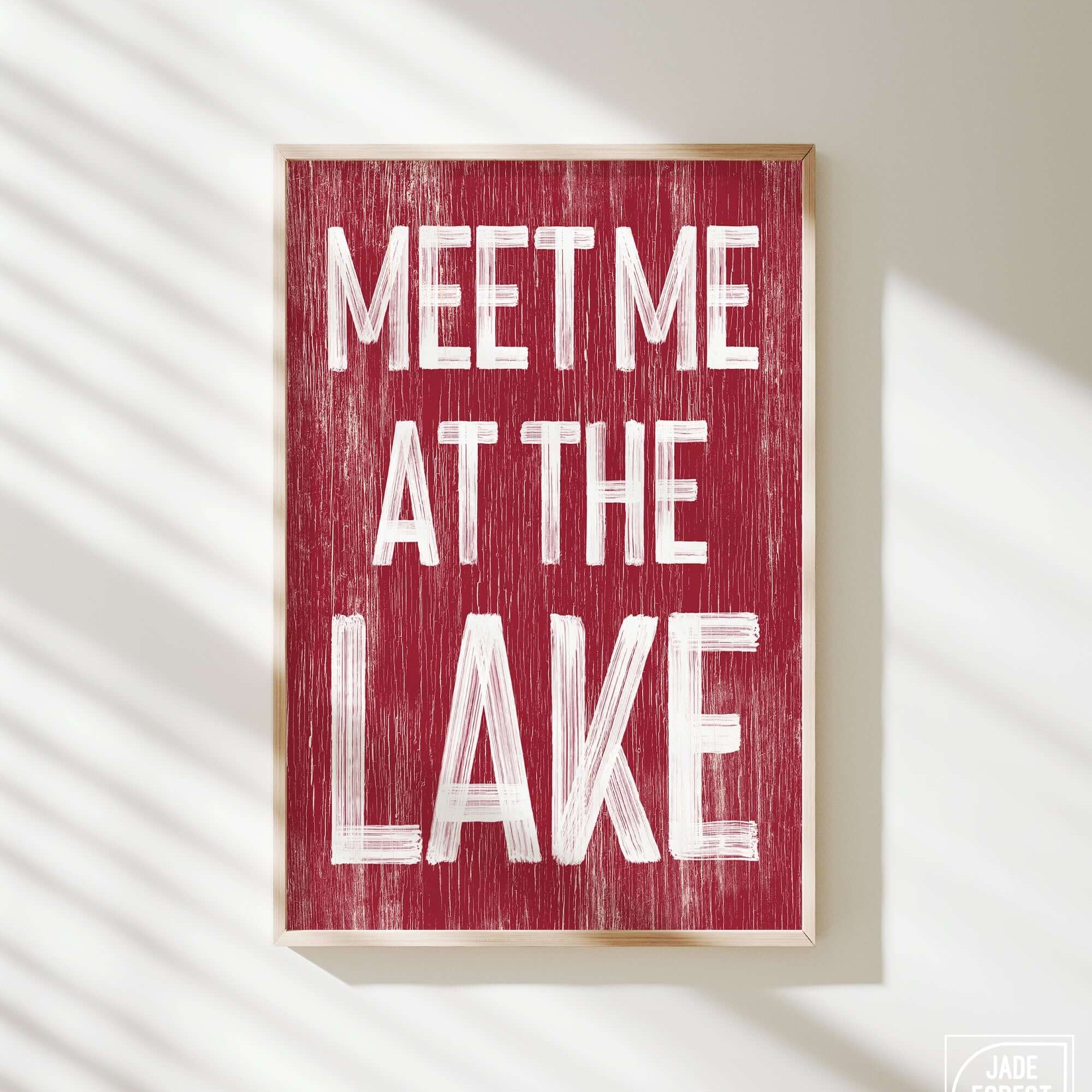 a red sign that says meet me at the lake