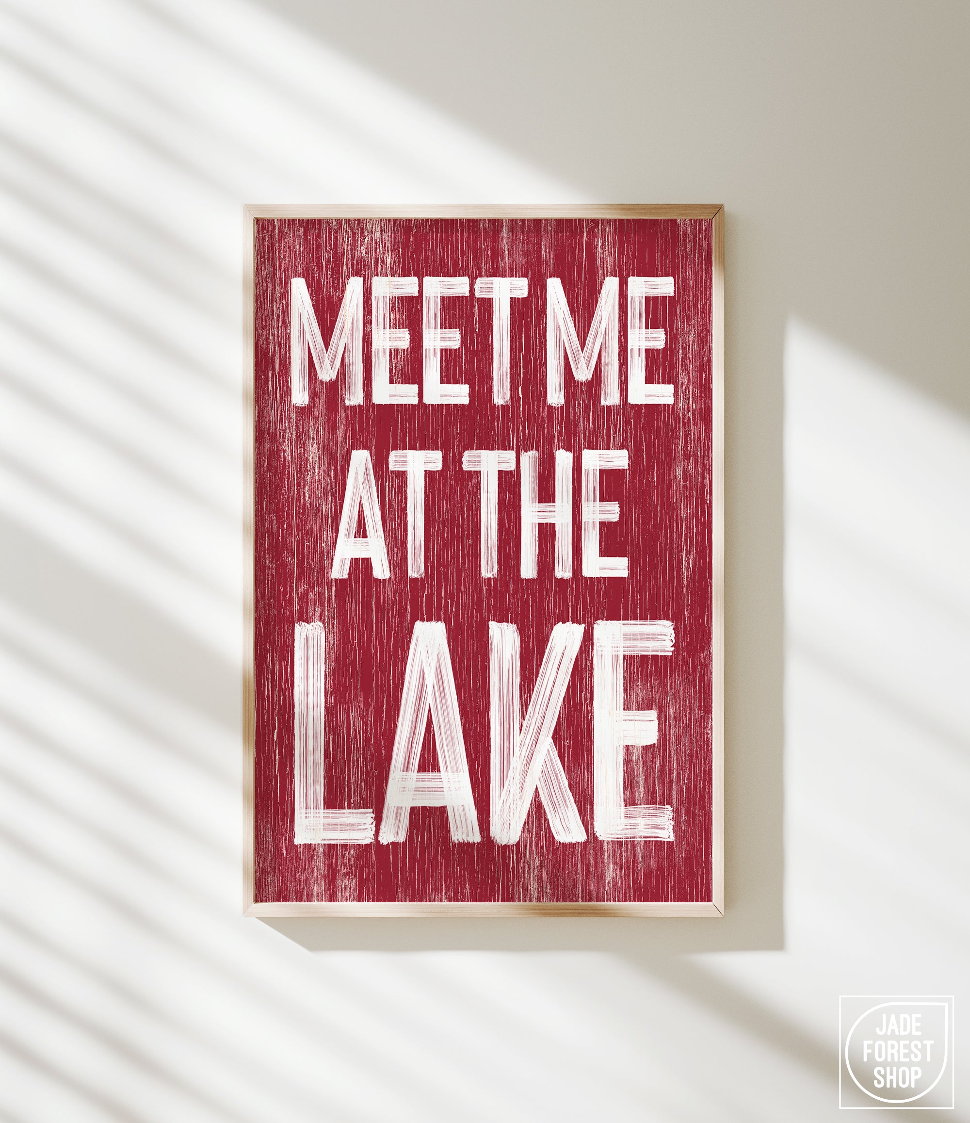 a red sign that says meet me at the lake