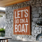 a sign that says let&#39;s go on a boat on a stone wall