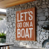 a sign that says let&#39;s go on a boat on a stone wall