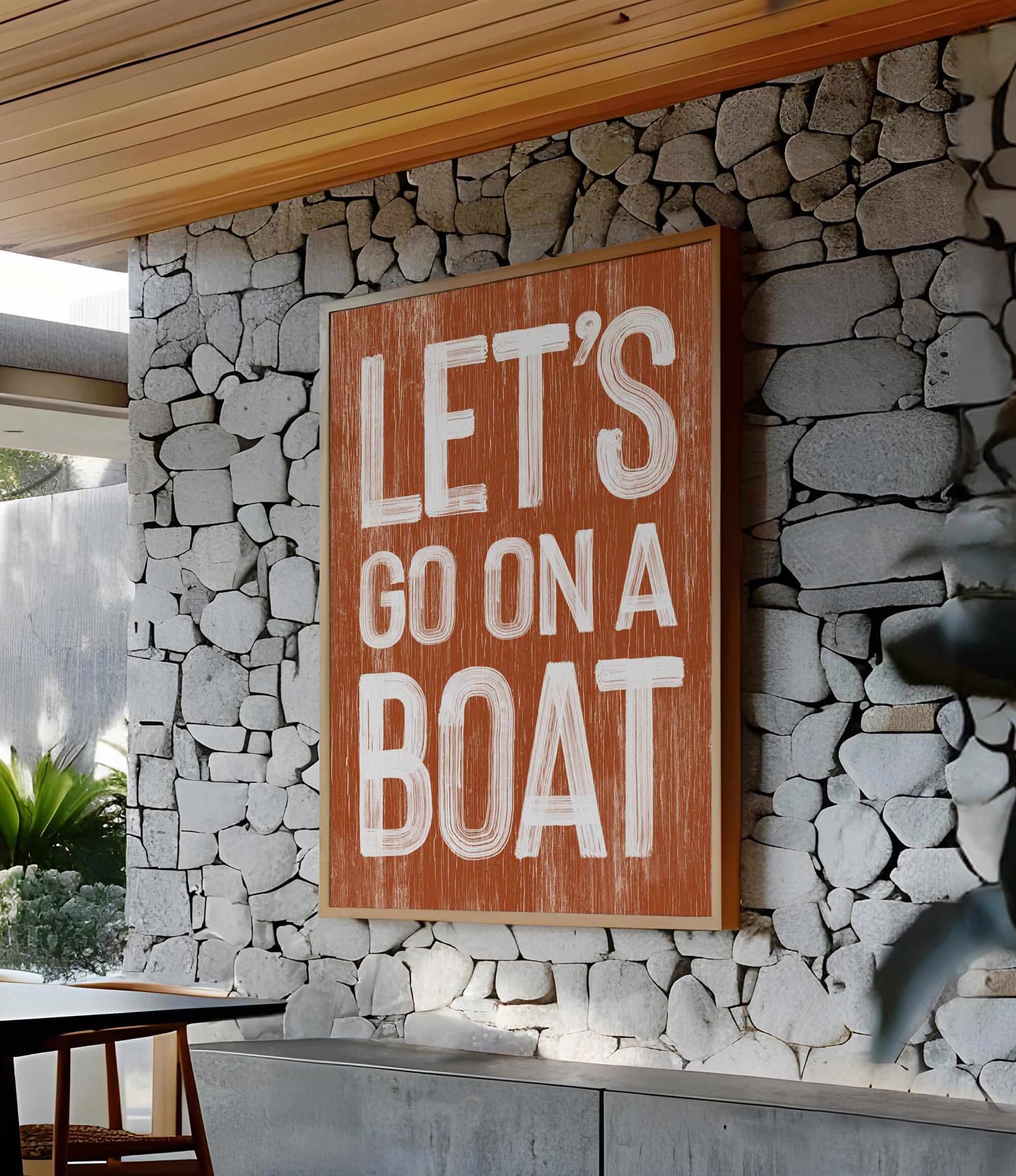 a sign that says let&#39;s go on a boat on a stone wall