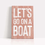 a wooden sign that says let&#39;s go on a boat