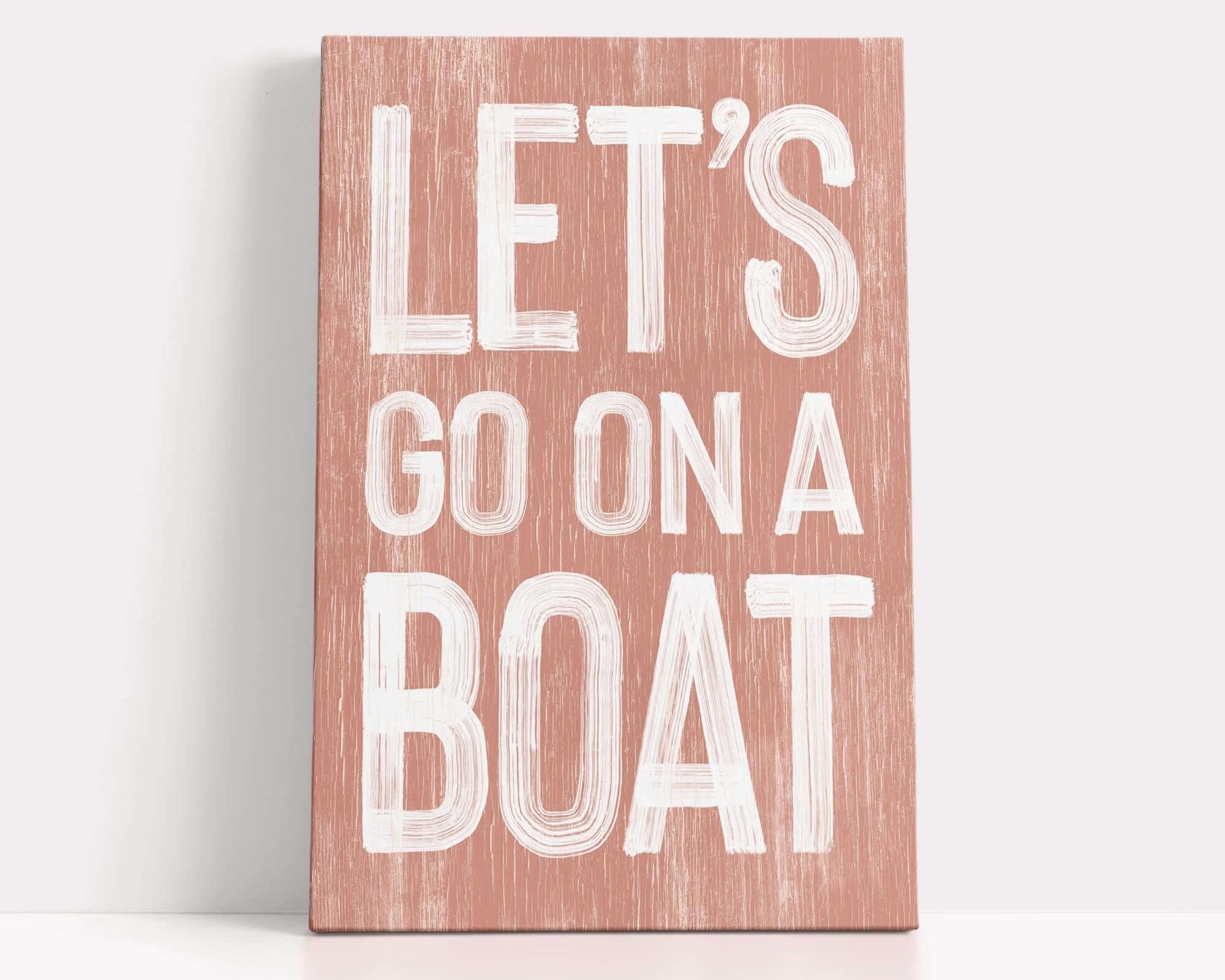 a wooden sign that says let's go on a boat