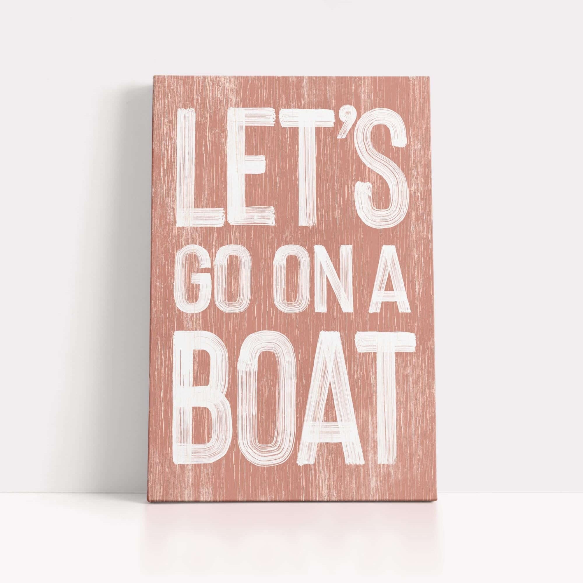 a wooden sign that says let's go on a boat